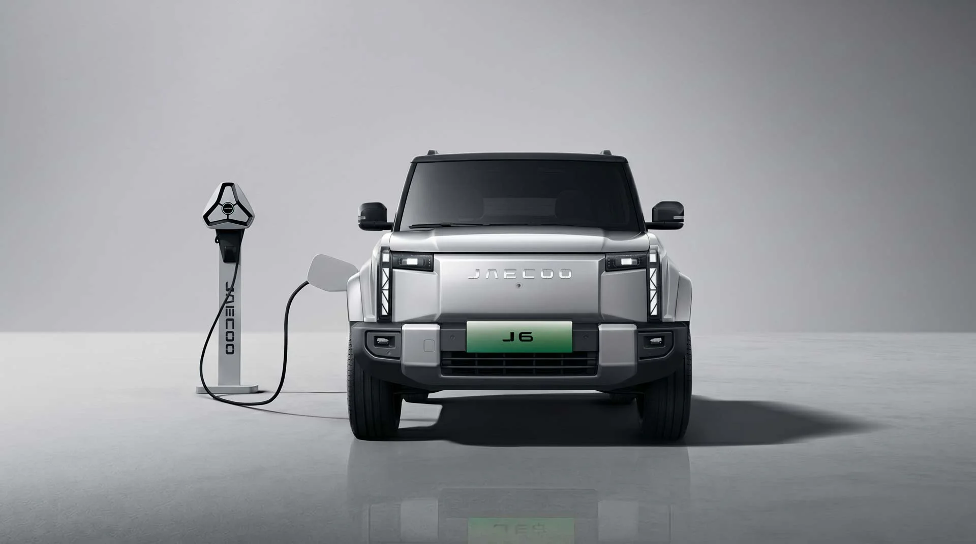JAECOO J5 EV charging beside a lake